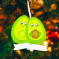 Load image into Gallery viewer, Personalized expecting couple ornament featuring a cute avocado couple design celebrating pregnancy and growing families. This joyful Christmas ornament can be customized with two names and a year, making it perfect for pregnancy announcements, expecting parents, baby reveals, and first Christmas as a family. A playful and heartwarming keepsake that captures love, excitement, and the beginning of a beautiful new chapter together.