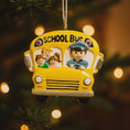 Load image into Gallery viewer, Decorative school bus ornament with children and a driver on a Christmas tree.