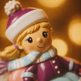 Load image into Gallery viewer, Toy figure of a girl in a purple outfit with a blurred warm background