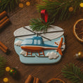 Load image into Gallery viewer, Decorative helicopter ornament on a wooden surface with Christmas decorations.