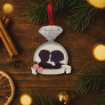 Load image into Gallery viewer, Decorative ornament with a diamond ring and silhouette of a couple on a wooden surface with Christmas decorations.