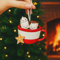 Load image into Gallery viewer, Personalized couple ornament featuring two smiling characters inside a cozy holiday mug design. This romantic Christmas ornament can be customized with two names and a family name or year, making it perfect for couples, partners, spouses, fiancés, or loved ones. Ideal for celebrating love, Valentine’s Day, anniversaries, newlyweds, or first holidays together. A warm and meaningful keepsake that captures shared moments and turns them into lasting holiday memories.