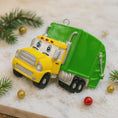 Load image into Gallery viewer, Cute personalized garbage truck ornament in green and yellow with animated truck face. Custom name and year option for kids who love trucks, garbage trucks, city vehicles and recycling themes. Perfect holiday tree decor for boys and toddlers obsessed with trucks. Bright colors, fun design, and adorable Christmas keepsake.