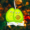 Load image into Gallery viewer, Personalized expecting couple ornament featuring a cute avocado couple design celebrating pregnancy and growing families. This joyful Christmas ornament can be customized with two names and a year, making it perfect for pregnancy announcements, expecting parents, baby reveals, and first Christmas as a family. A playful and heartwarming keepsake that captures love, excitement, and the beginning of a beautiful new chapter together.