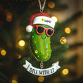 Load image into Gallery viewer, Decorative pickle ornament with sunglasses and Santa hat on a Christmas tree.