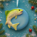 Load image into Gallery viewer, Fish-shaped ornament on a blue background with Christmas decorations