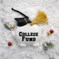Load image into Gallery viewer, White piggy bank labeled 'College Fund' with a graduation cap and tassel on a snowy background.