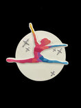 Load image into Gallery viewer, Colorful figure skating brooch on a black background