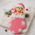 Load image into Gallery viewer, Personalized Baby Girl Christmas Ornament featuring a sweet baby in a pink stocking with raised 3D front details and textured snowflake accents. The name is added on the hat and the year on the stocking, creating a meaningful newborn keepsake. Soft pink tones, holiday elements, and dimensional design make it perfect for babyâs first Christmas, baby girl gift, and special family memory ornament for the tree.
