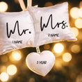 Load image into Gallery viewer, Personalized Mr and Mrs pillow ornament featuring a soft white cushion design with hanging heart detail. A romantic keepsake for newlyweds celebrating their first Christmas married or Valentine’s Day. Perfect wedding gift anniversary decor and couple ornament.