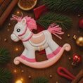 Load image into Gallery viewer, Pink rocking horse toy on a wooden surface with Christmas decorations
