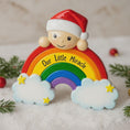 Load image into Gallery viewer, Decorative ornament with rainbow, clouds, and 'Our Little Miracle' text, featuring a Santa hat.