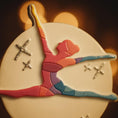 Load image into Gallery viewer, Colorful ornament sculpture of a dancer with a star on a dark background