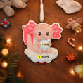 Load image into Gallery viewer, Decorative baby ornament with wings on a wooden surface surrounded by Christmas decorations.