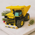 Load image into Gallery viewer, dump truck on a white surface with decorative elements