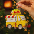 Load image into Gallery viewer, Yellow taco truck ornament with 'Tyler' and 'Year' text, held by a hand against a festive background.
