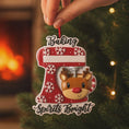 Load image into Gallery viewer, Personalized baking ornament featuring a festive red stand mixer design with snowflake details and a cute reindeer bowl accent. Finished with a smooth glossy surface and holiday inspired colors. Includes free handwritten personalization with one name and year displayed on the mixer. Designed with a raised 3D front and flat back for easy hanging. Styled in a cozy Christmas setting with snow greenery and ornaments, perfect for bakers home cooks and holiday keepsakes.