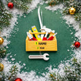Load image into Gallery viewer, Personalized handyman ornament featuring a wooden style toolbox filled with tools including hammer wrench pliers and level. Custom name and year displayed on the front. Mostly 2D design with raised 3D tool details on the surface. Perfect Christmas ornament for handyman contractors mechanics and skilled trade workers.