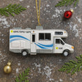 Load image into Gallery viewer, RV-shaped Christmas ornament on a textured surface with decorative elements