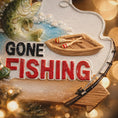 Load image into Gallery viewer, Decorative sign with 'Gone Fishing' text, fishing rod, and fish on a blurred background.