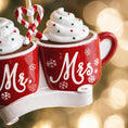 Load image into Gallery viewer, Romantic Mr and Mrs Christmas ornament featuring cozy hot cocoa cups design symbolizing love and togetherness. A perfect keepsake for newlyweds couples celebrating their first Christmas married. Ideal wedding gift holiday decor and meaningful seasonal ornament.