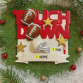 Load image into Gallery viewer, Decorative Christmas ornament with footballs, helmet, and 'Touch Down' text on a green background.
