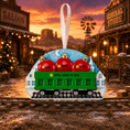 Load image into Gallery viewer, Decorative train ornament with red apples and green boxcar against a western-themed background.