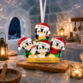 Load image into Gallery viewer, Personalized penguin family ornament on a table with a cozy background
