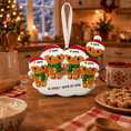 Load image into Gallery viewer, Personalized gingerbread family ornament on a kitchen counter with Christmas decorations.