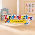 Load image into Gallery viewer, Colorful ornament 'Kindergarten' sign with educational items on a beige surface.