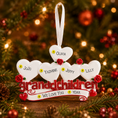 Load image into Gallery viewer, Personalized Christmas ornament with hearts and names on a decorated tree background