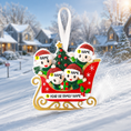 Load image into Gallery viewer, Personalized Christmas ornament with cartoon family on a sleigh in a snowy village setting