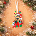 Load image into Gallery viewer, Personalized Christmas ornament with reindeer design on a decorative background with ornaments and snow.