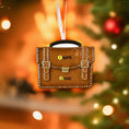 Load image into Gallery viewer, Small brown briefcase ornament on a green surface with Christmas decorations