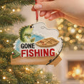 Load image into Gallery viewer, Fishing-themed Christmas ornament with a boat and fish on a tree.