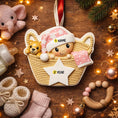 Load image into Gallery viewer, Personalized Baby Girl First Christmas Ornament featuring a detailed 3D front design with a sweet baby resting inside a woven basket, pink nightcap, teddy bear, and hanging star for the year. The babyâs name is added on the hat and the year on the star, creating a meaningful keepsake. Soft pink tones, cozy textures, and dimensional elements make it perfect for newborn girl gifts, baby shower presents, and treasured first Christmas tree memories.
