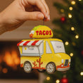 Load image into Gallery viewer, Taco truck ornament with 'Tyler' and 'Year' text, held by a hand against a blurred Christmas tree background.