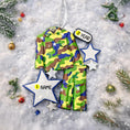 Load image into Gallery viewer, A glossy resin Army soldier uniform ornament in green brown and blue camouflage colors features a military jacket and pants shape with raised buttons and pockets, white and blue star accents, light snow texture, a smooth painted cartoon style finish, and handwritten personalization showing a name and year on the attached tag, designed as a mostly 2D ornament with raised 3D details on the front only for Christmas tree decor.