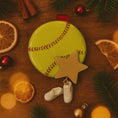 Load image into Gallery viewer, Decorative softball with a star ornament on a wooden surface with Christmas decorations.