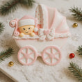 Load image into Gallery viewer, Personalized baby girl Christmas ornament featuring a soft pink stroller with glitter details and a smiling baby wearing a pink nightcap. Custom name appears on the top and year on the bottom, making it a perfect Baby’s First Christmas keepsake. This pink resin holiday ornament is ideal for newborn girls, baby shower gifts, and celebrating a special first Christmas memory.