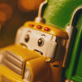 Load image into Gallery viewer, Cute personalized garbage truck ornament in green and yellow with animated truck face. Custom name and year option for kids who love trucks, garbage trucks, city vehicles and recycling themes. Perfect holiday tree decor for boys and toddlers obsessed with trucks. Bright colors, fun design, and adorable Christmas keepsake.