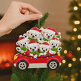 Load image into Gallery viewer, Decorative Christmas ornament with polar bears in a car on a Christmas tree.
