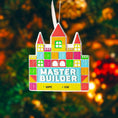 Load image into Gallery viewer, Colorful toy block castle ornament with 'Master Builder' text against a blurred festive background.
