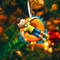 Load image into Gallery viewer, Decorative ornament of a child on an inner tube with 'Bryce' written on it, against a blurred natural background.