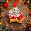 Load image into Gallery viewer, Personalized Christmas ornament with two polar bears in a sled on a wooden background with decorations.