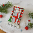 Load image into Gallery viewer, Decorative phone case with Christmas-themed design on a snowy background with pine branches and ornaments.