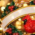 Load image into Gallery viewer, Personalized cardinal wreath ornament featuring a vibrant red cardinal bird surrounded by green holly leaves and red berries. Designed with a smooth glossy finish and a raised 3D front with a flat back for easy hanging. Includes free handwritten personalization with one name and year displayed on the banner at the top. Styled in a warm festive holiday setting with soft Christmas lights candy details and seasonal decor. A meaningful Christmas tree ornament symbolizing remembrance love and connection perfect