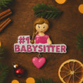 Load image into Gallery viewer, Personalized Babysitter Christmas ornament featuring a detailed raised 3D front design with glitter pink lettering and a charming girl figure. Custom name is added on the shirt and year is written on the hanging heart charm. Bright pink and white holiday colors stand out beautifully on the tree. Flat 2D back for easy hanging. Perfect keepsake gift for babysitter appreciation, nanny thank you present, childcare provider Christmas decor.