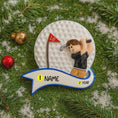Load image into Gallery viewer, Golf-themed ornament with a golfer on a golf ball, surrounded by Christmas decorations.