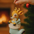 Load image into Gallery viewer, A glossy resin baby deer ornament features a cute fawn character sitting inside a soft pastel blue winter boot, holding a striped candy cane, with gentle antler details, smooth painted cartoon style finish, soft holiday lighting and blurred festive background, handwritten personalization showing the baby name on the boot and the year or Baby’s First Christmas text below, designed as a mostly 2D ornament with raised 3D details on the front only.